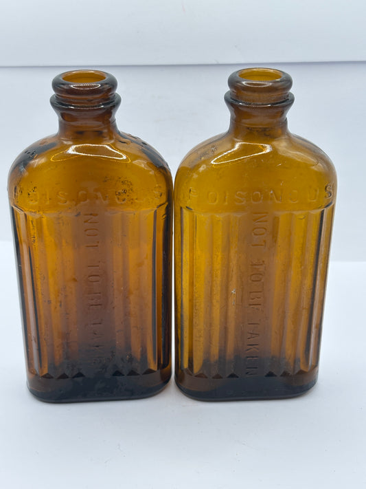 2 old amber glass ribbed poison bottes, not to be taken