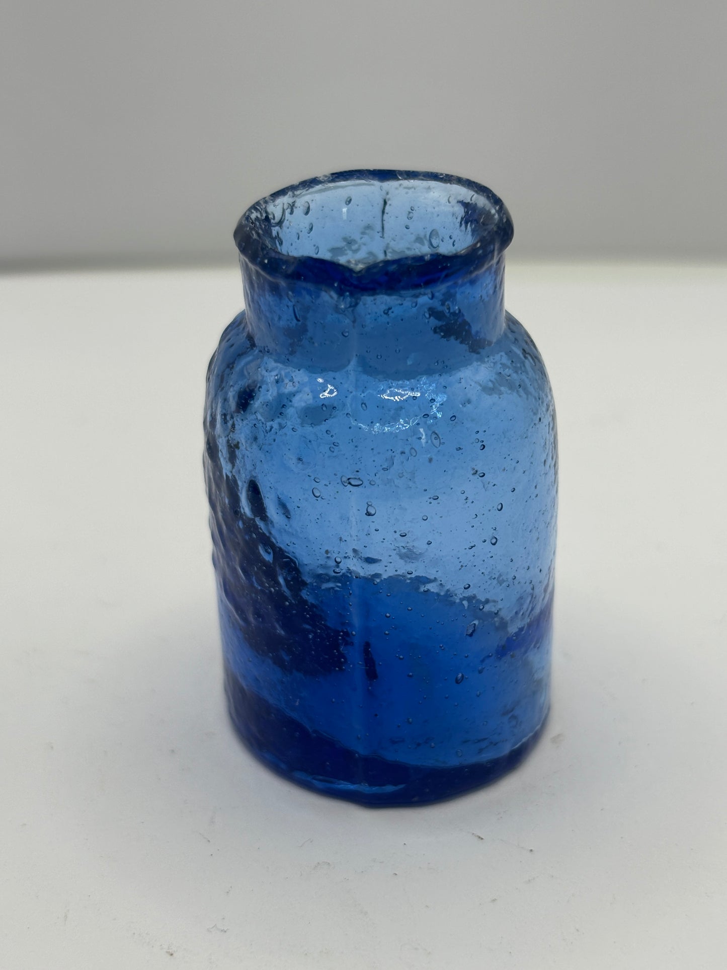 Small blue rat paste bottle