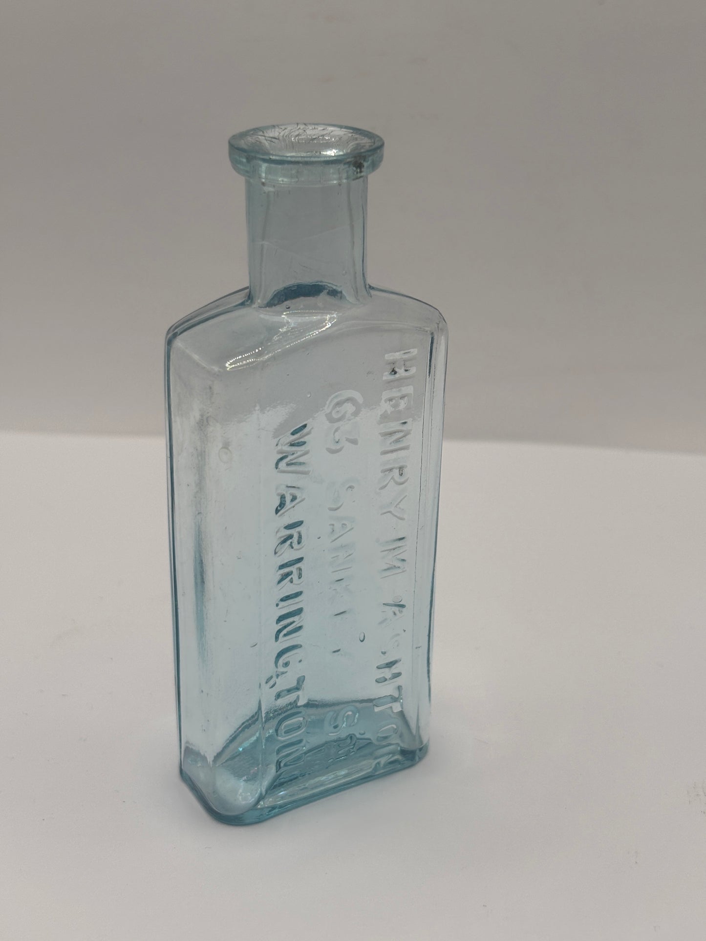 Old glass advertising chemist bottle, Warrington