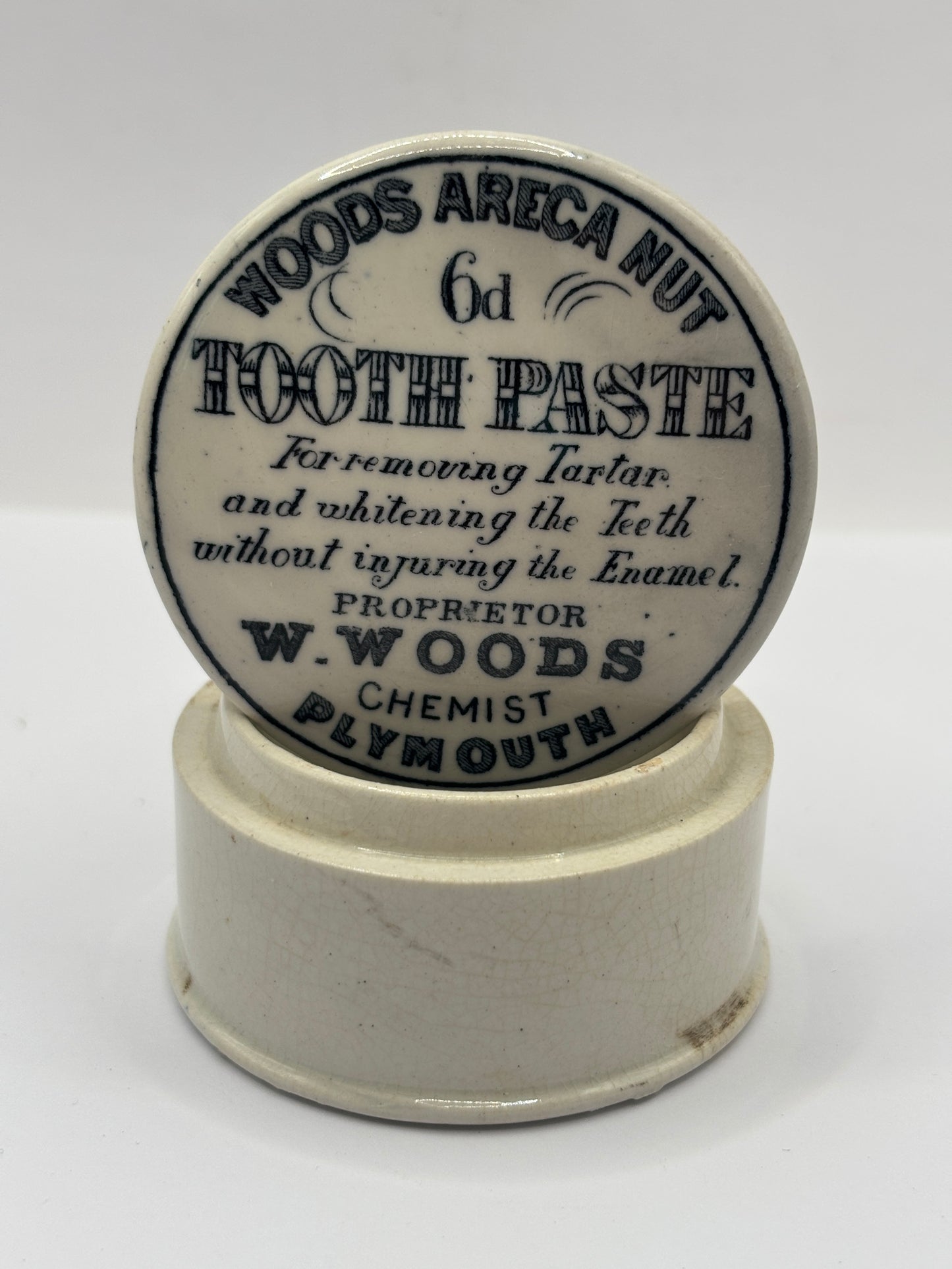 Old advertising lid and base. Woods areca nut tooth paste