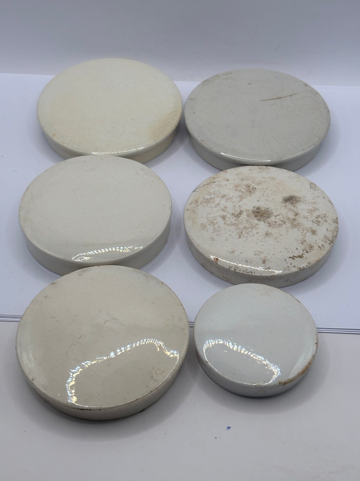 6 old stoneware lids, stackers (F)
