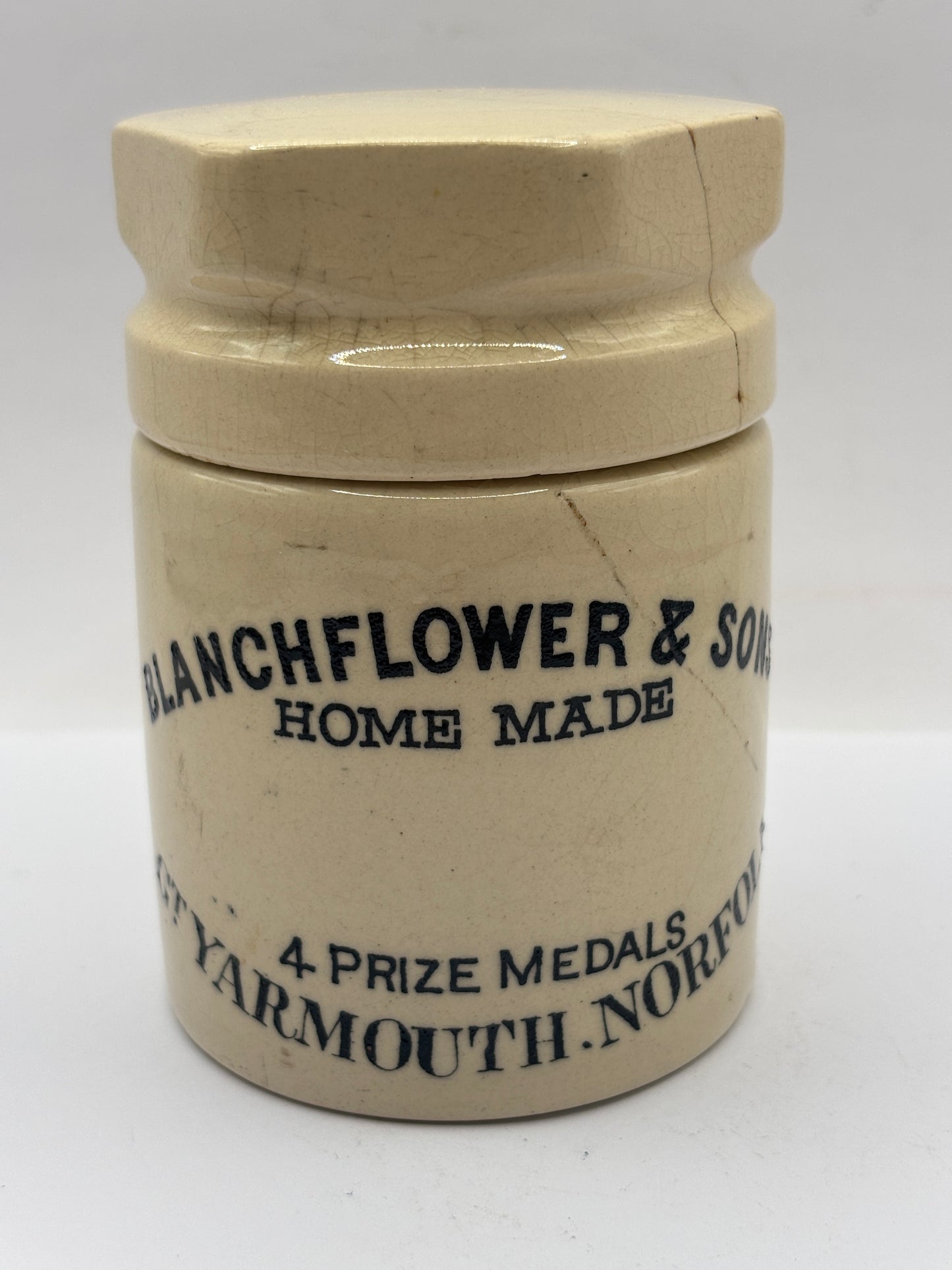 Old stoneware potted meat jar and lid. Blanchflower. Damaged