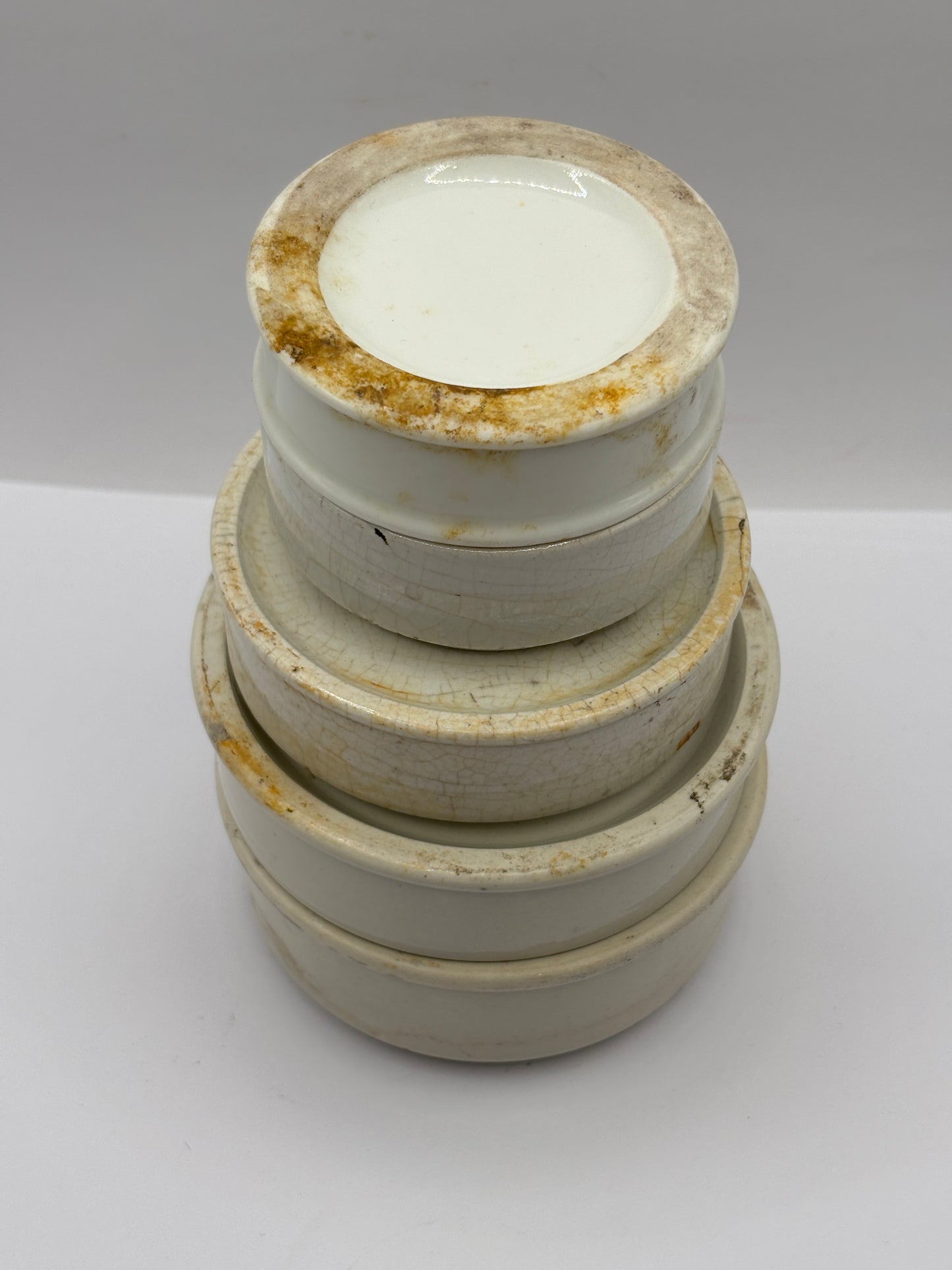 5 plain stoneware bases, stackers. Chipped