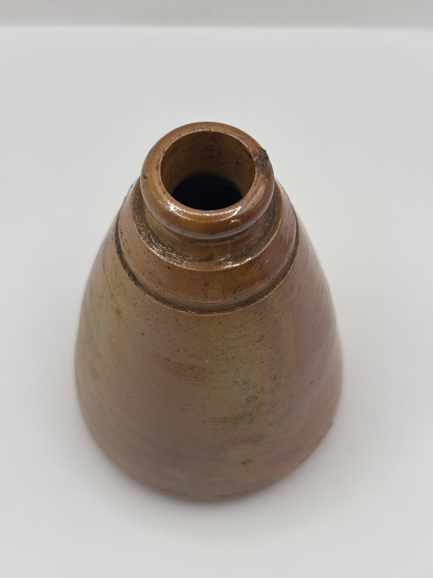 Old brown stoneware inkwell, ink bottle. Cone ink