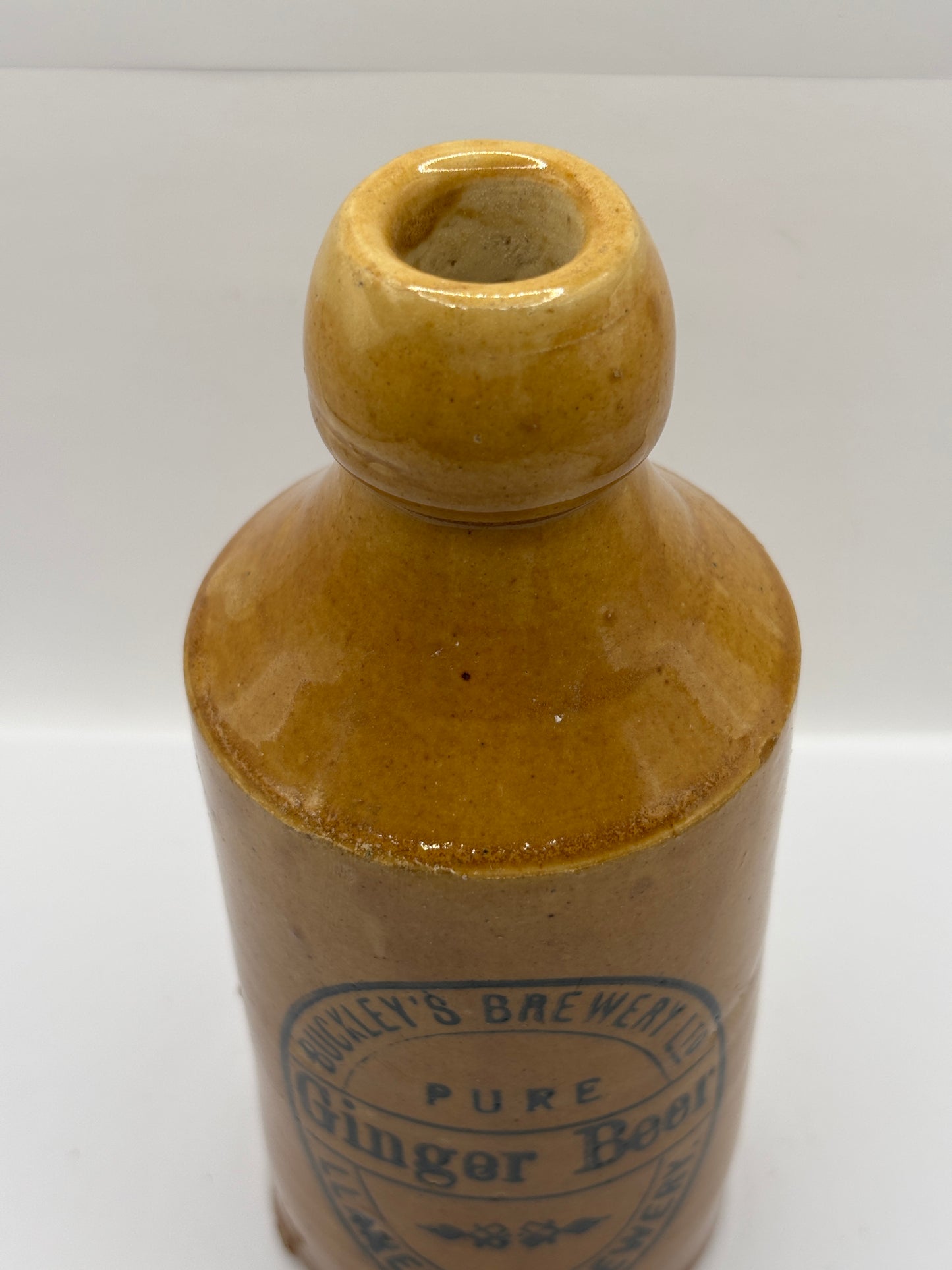 Old stoneware ginger beer bottle, Buckleys brewery, Pure ginger beer. Llanelly brewery