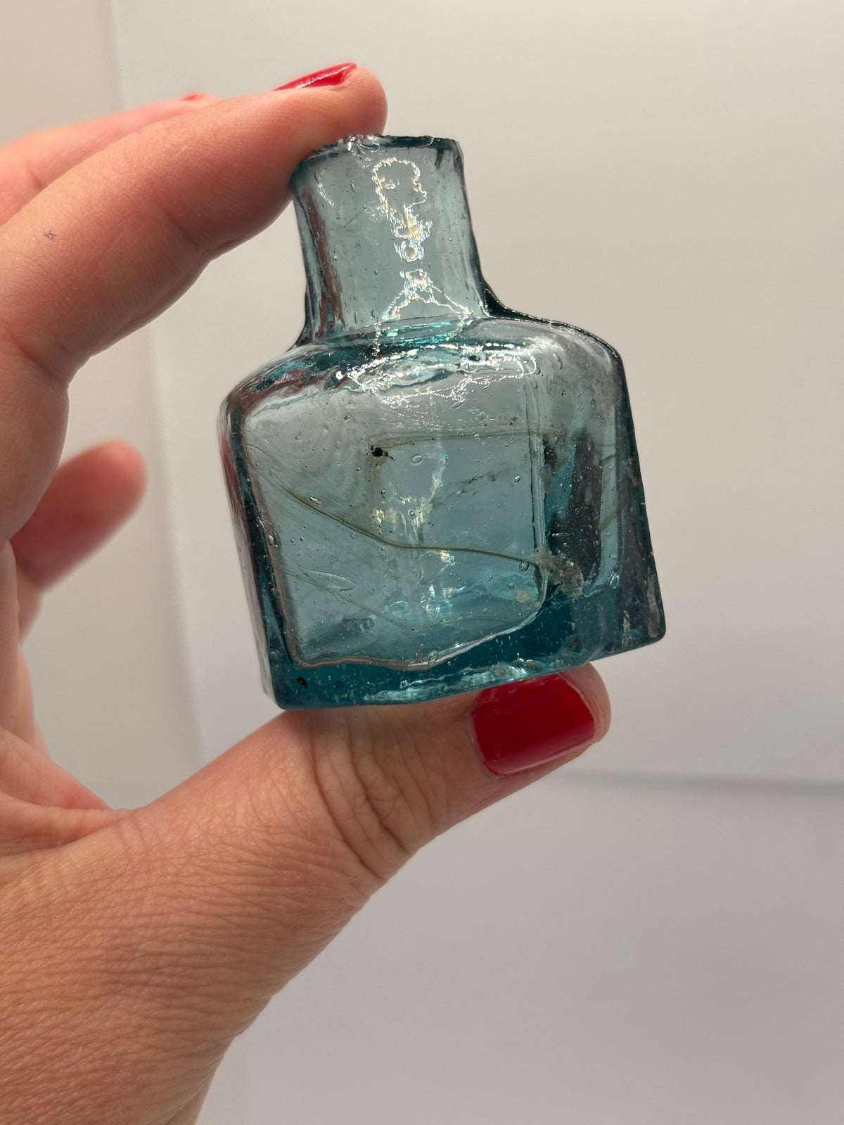 Old blue glass inkwell, ink bottle, penny ink with swirls