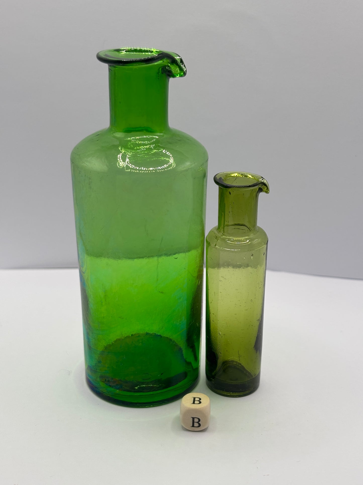 2 old green glass bottles with pouring lips (B)