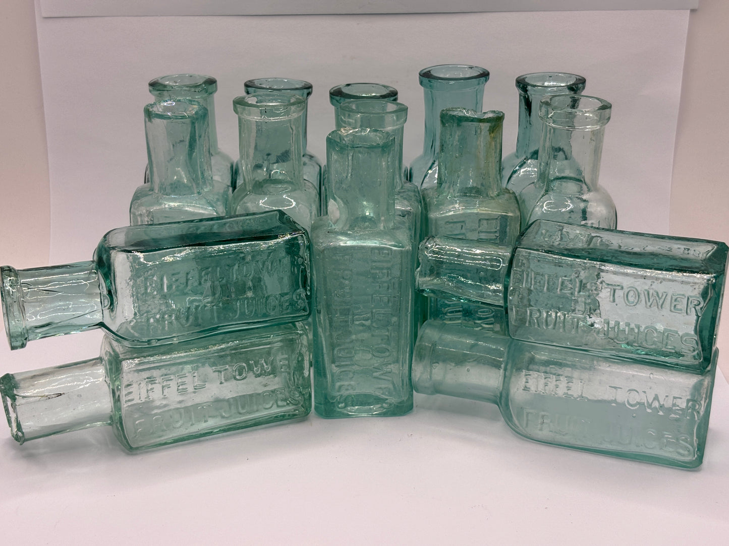 15 old Eiffel tower lemonade bottles