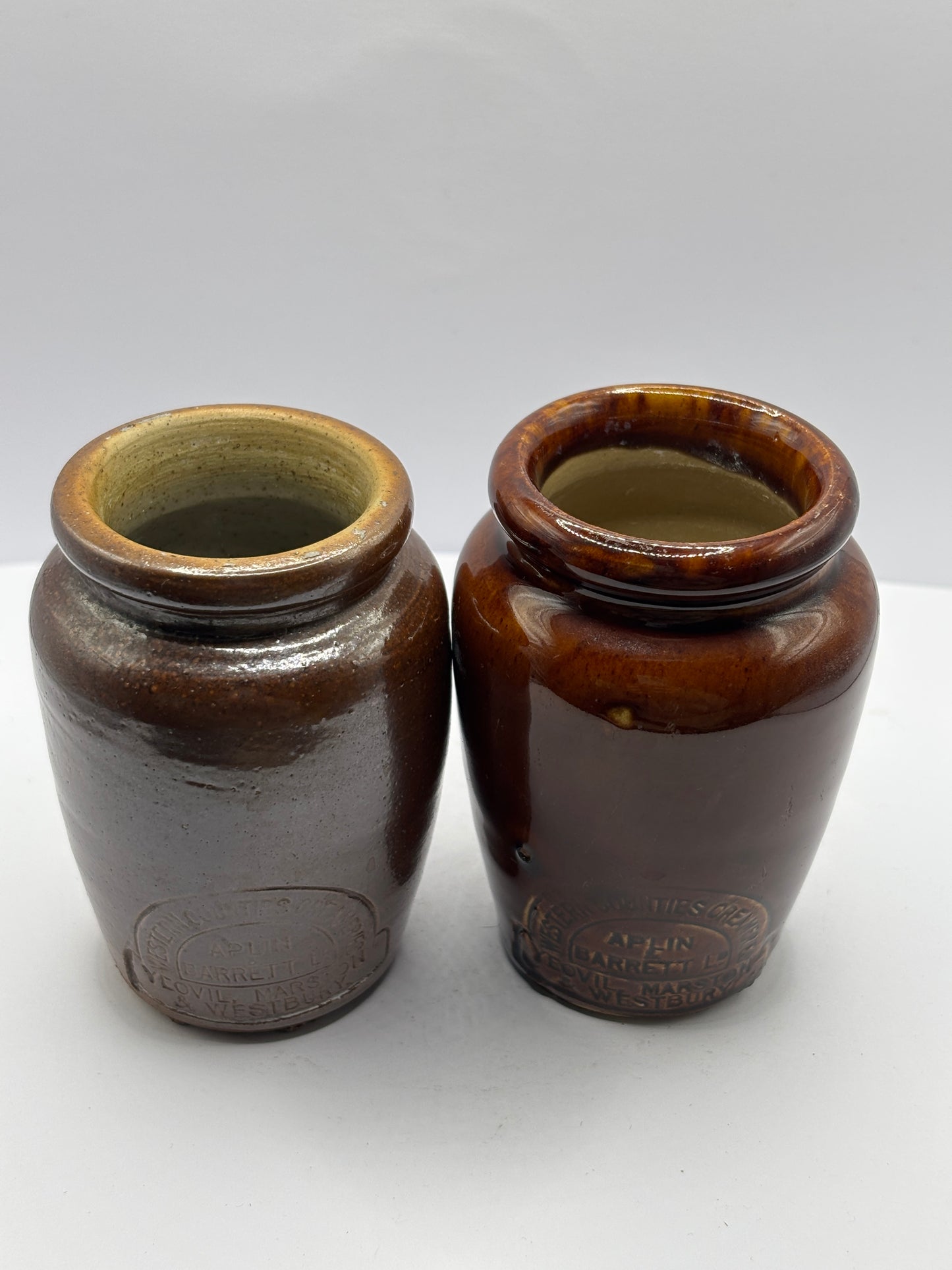 2 old brown stoneware cream pots, west counties creameries