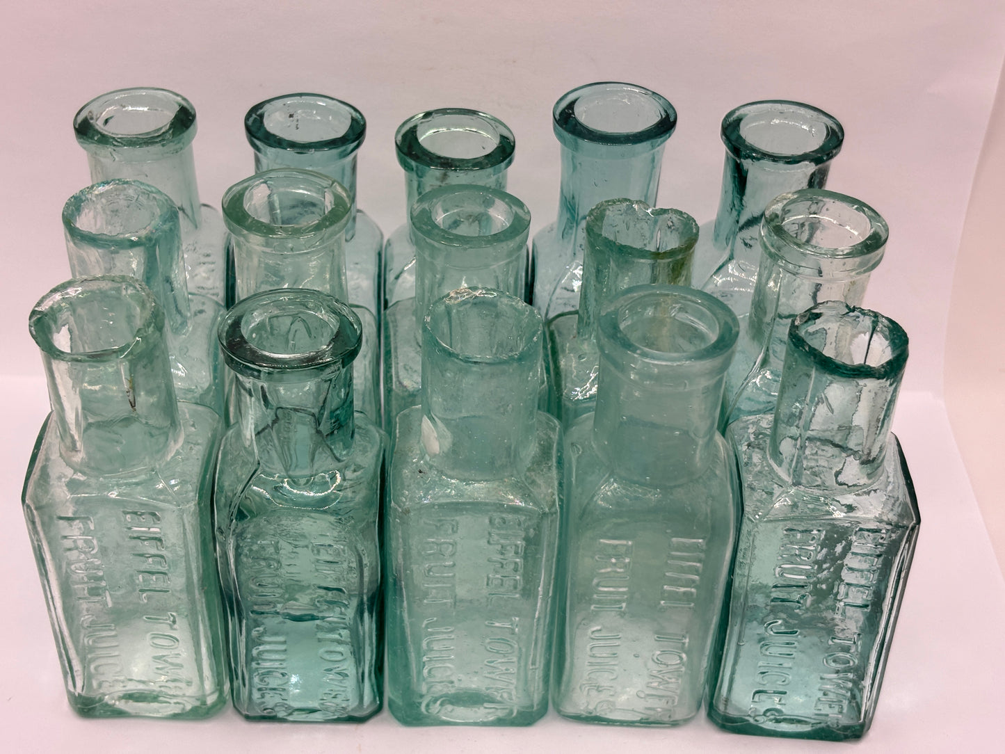 15 old Eiffel tower lemonade bottles