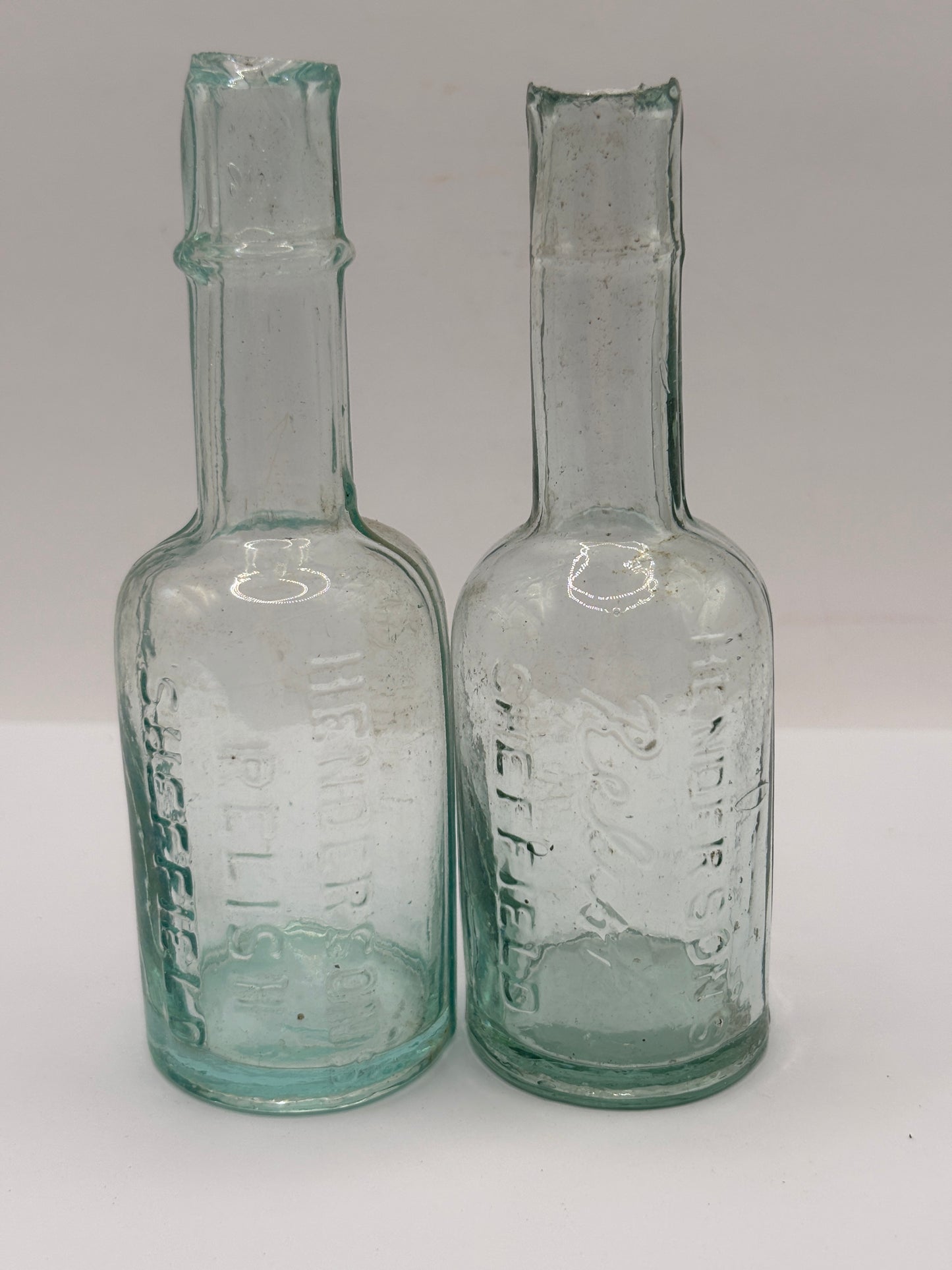 2 old aqua glass Henderson’s relish bottles