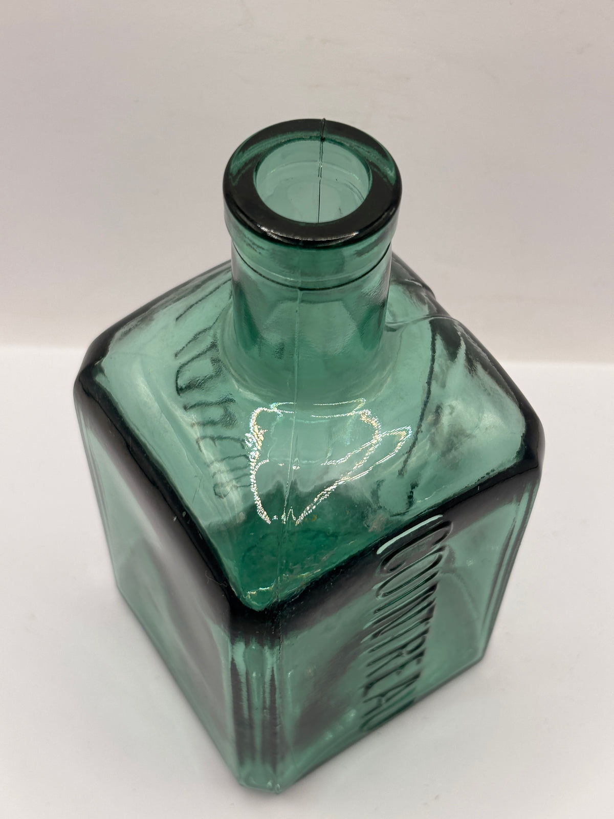 Old green liqueur bottle, contreau