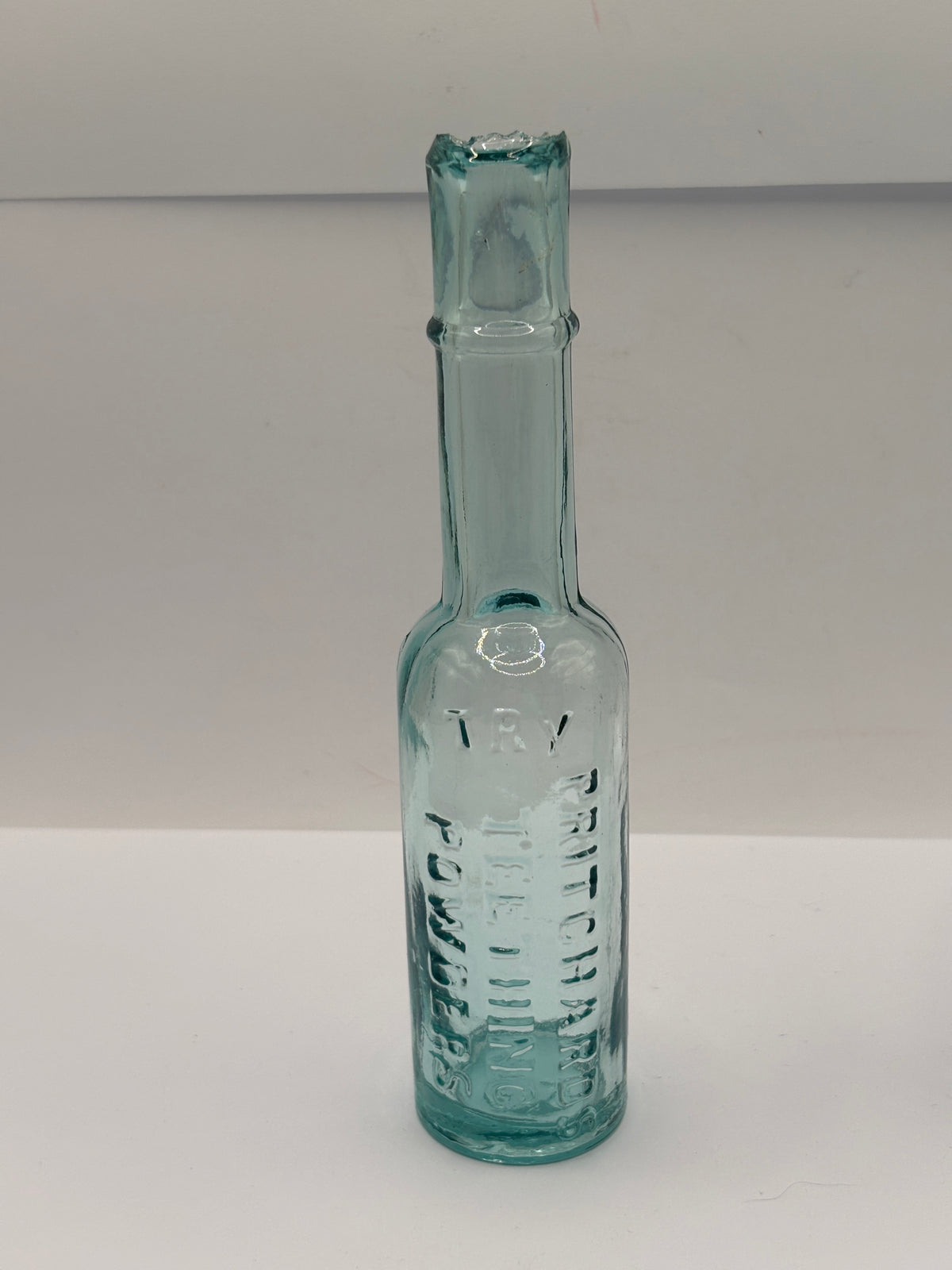Old aqua glass chemist bottle, Pritchards teething powders