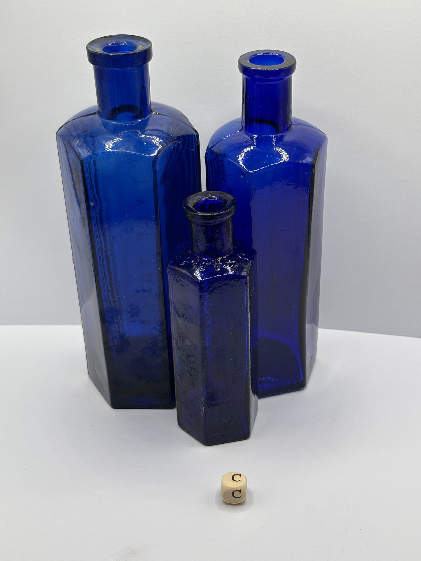 3 old blue poison bottles, not to be taken. Poisonous
