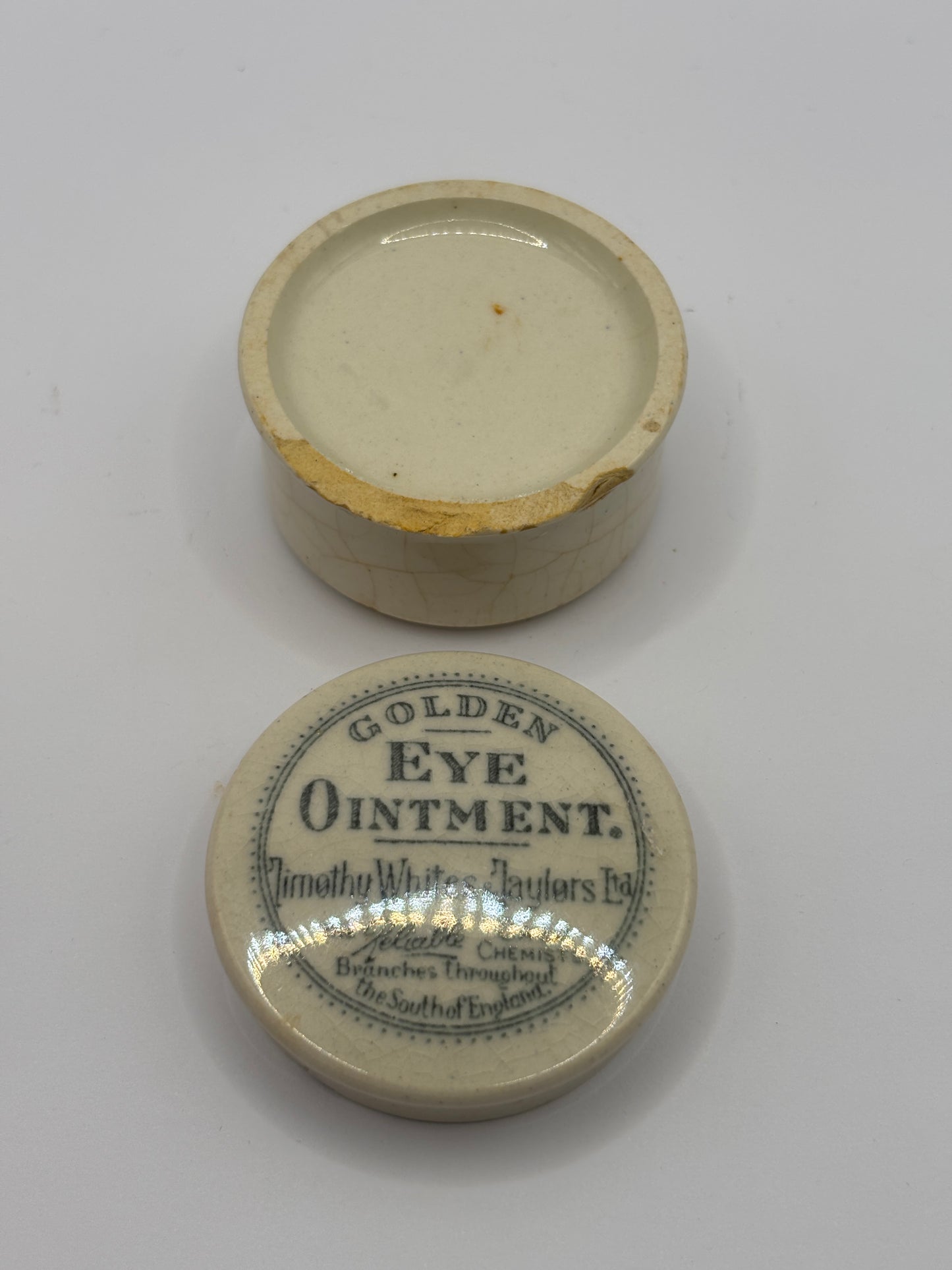 Old advertising lid and base, Timothy Whites Golden eye ointment