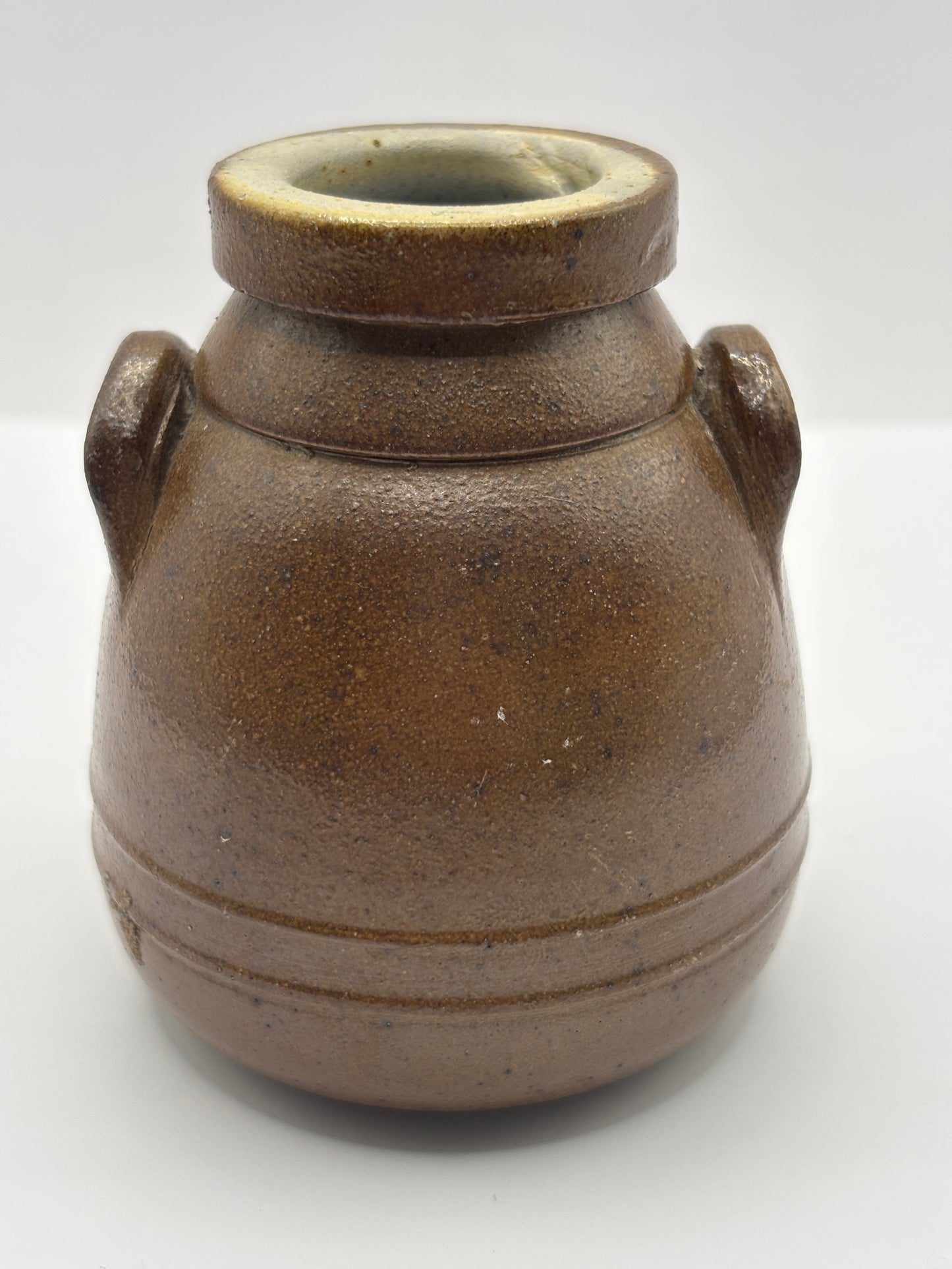 Old brown stoneware Benoist jar