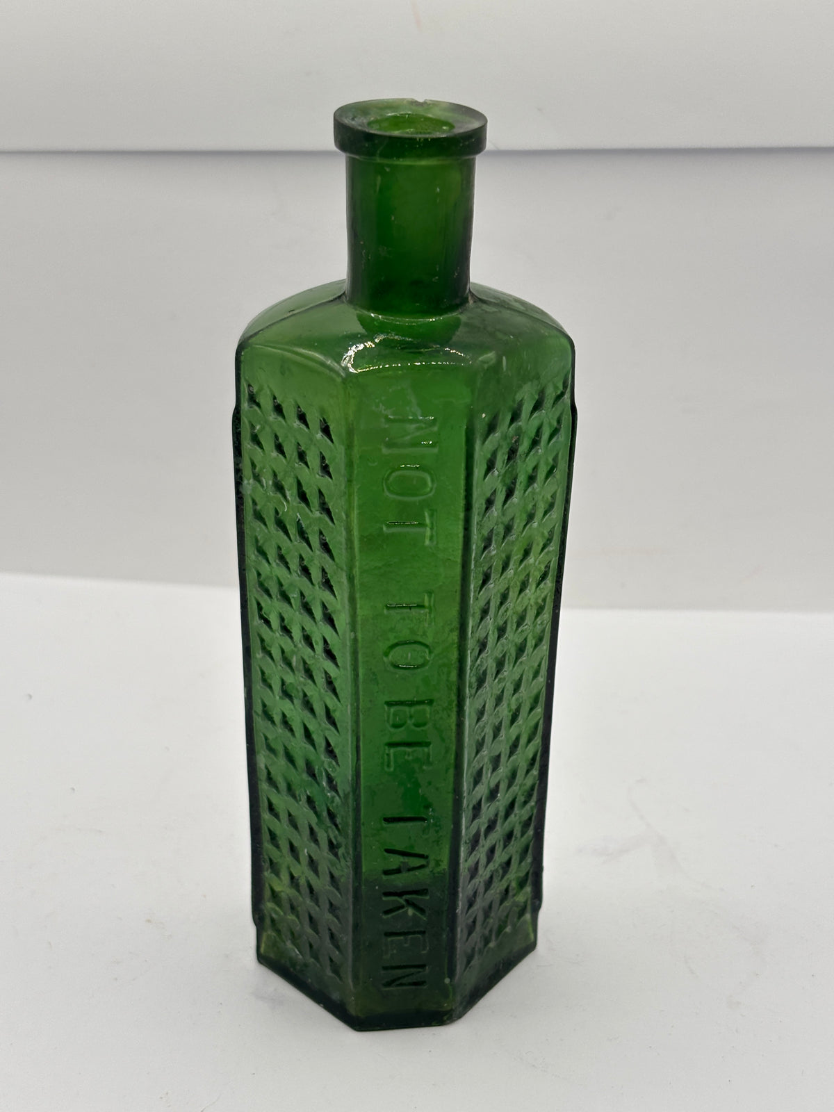 Old crusty green flat back poison bottle, Not to be taken