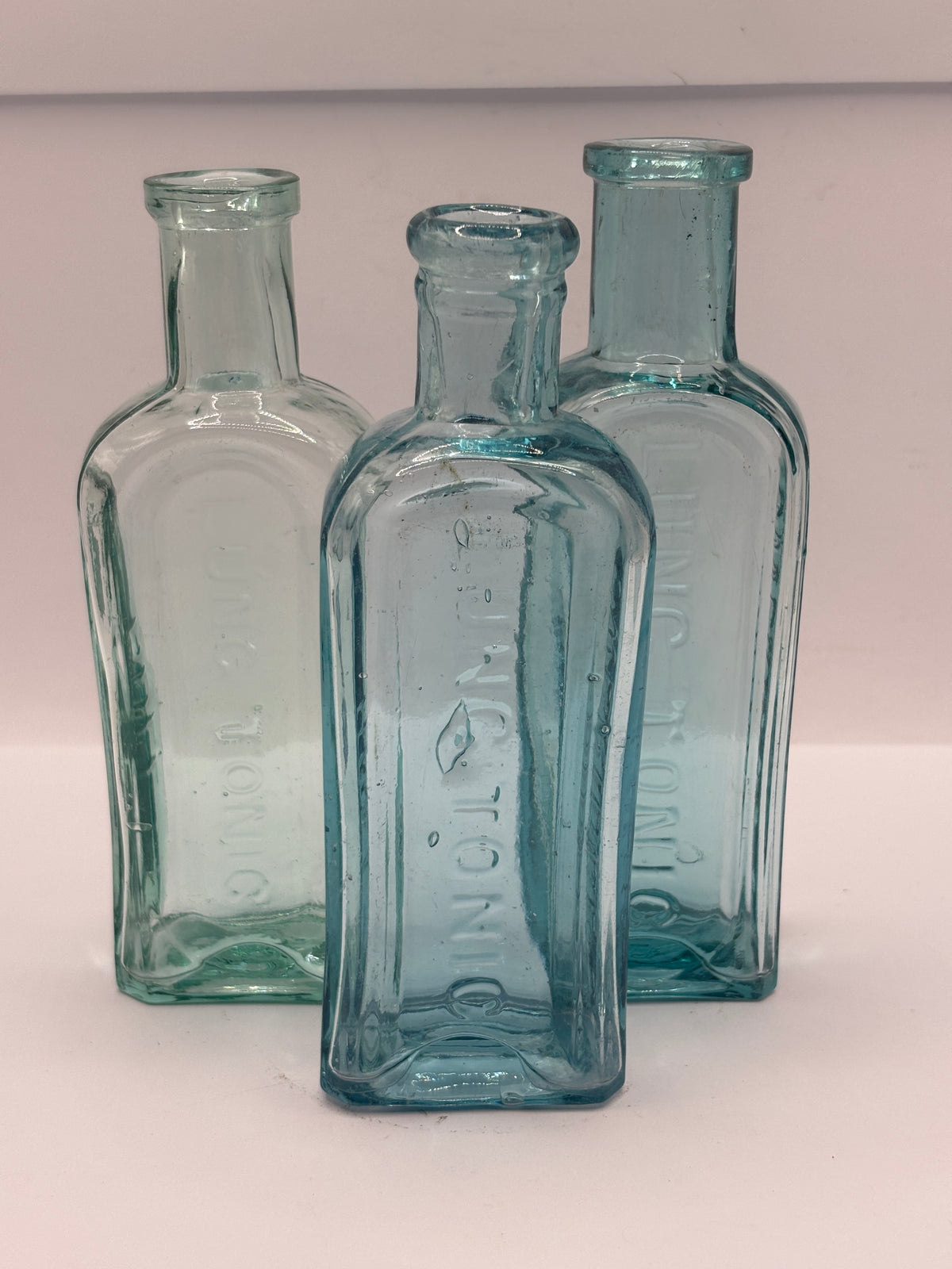 2 old aqua glass Lung tonic bottles