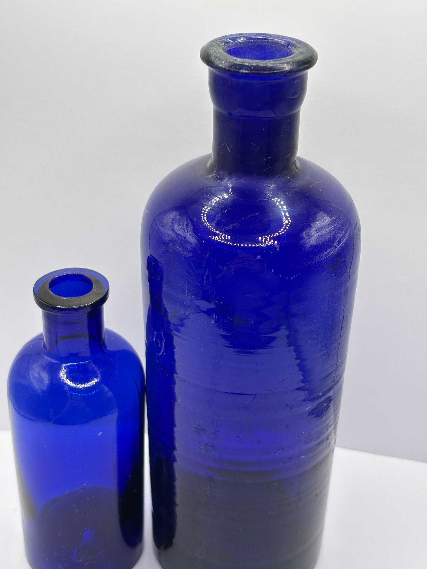 2 old large blue poison/chemist bottles