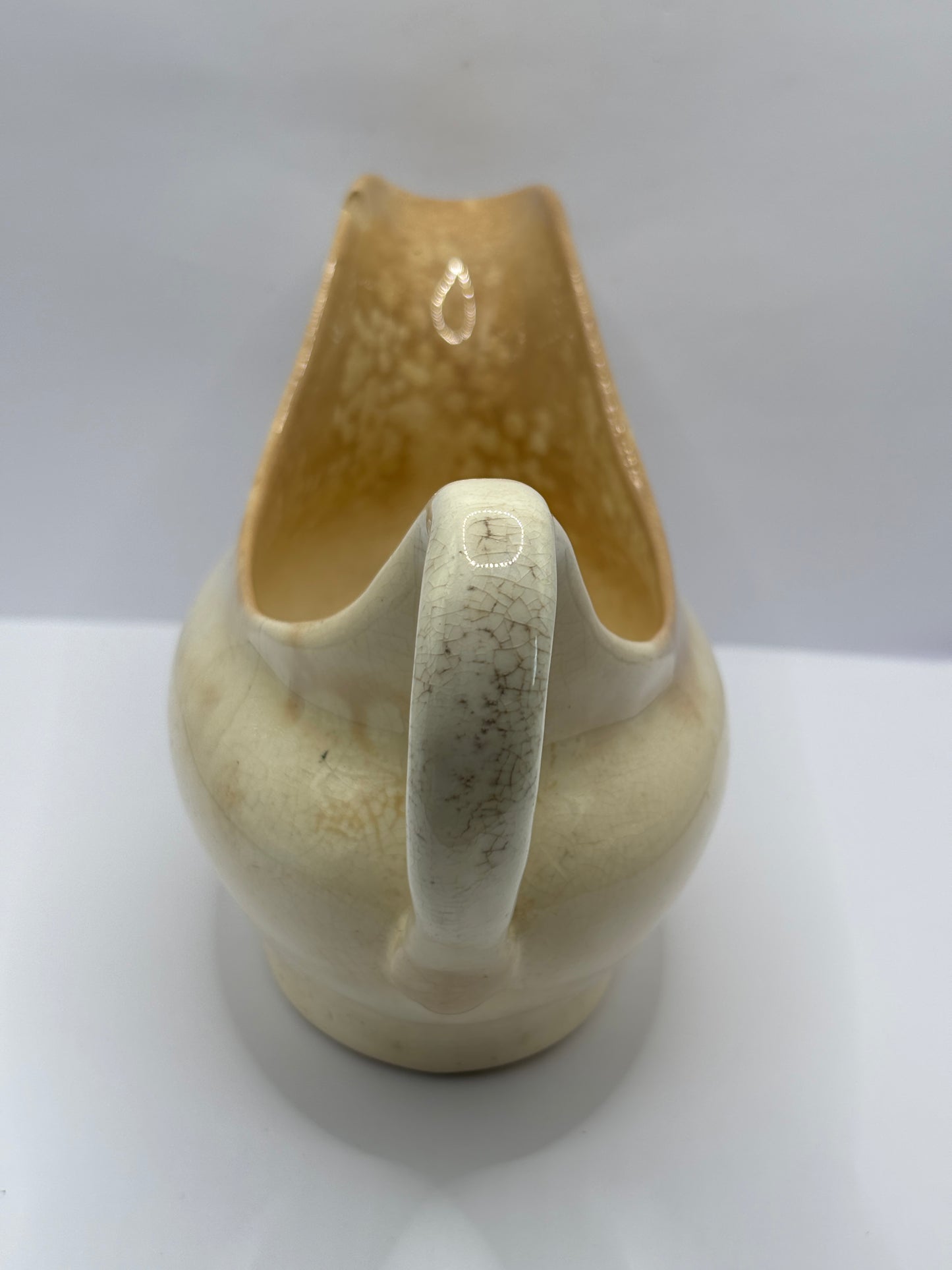 Old stained & crazed handled jug, gravy boat