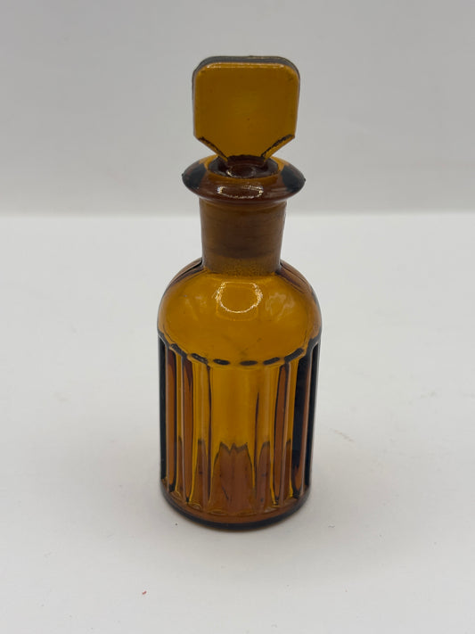 Small amber glass poison bottle with original stopper