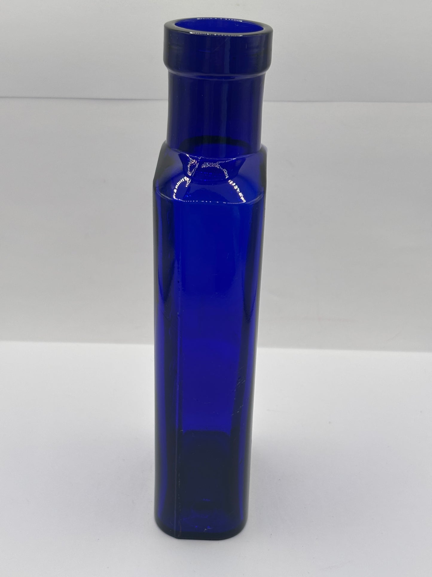Old blue glass advertising bottle, Granular citrate of magnesia