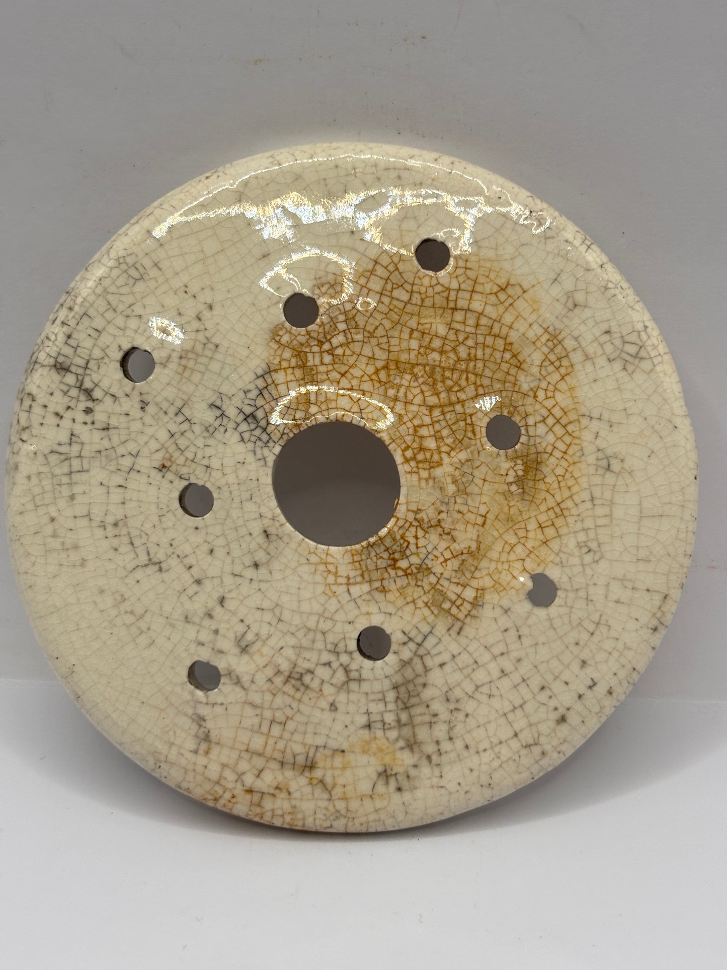 Old stoneware strainer, stained & crazed
