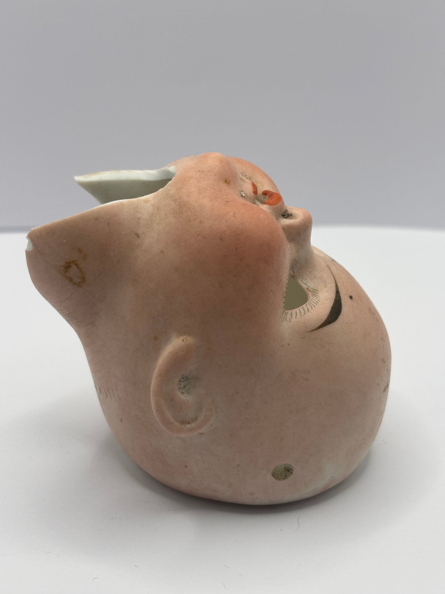 Old dolls head, damaged