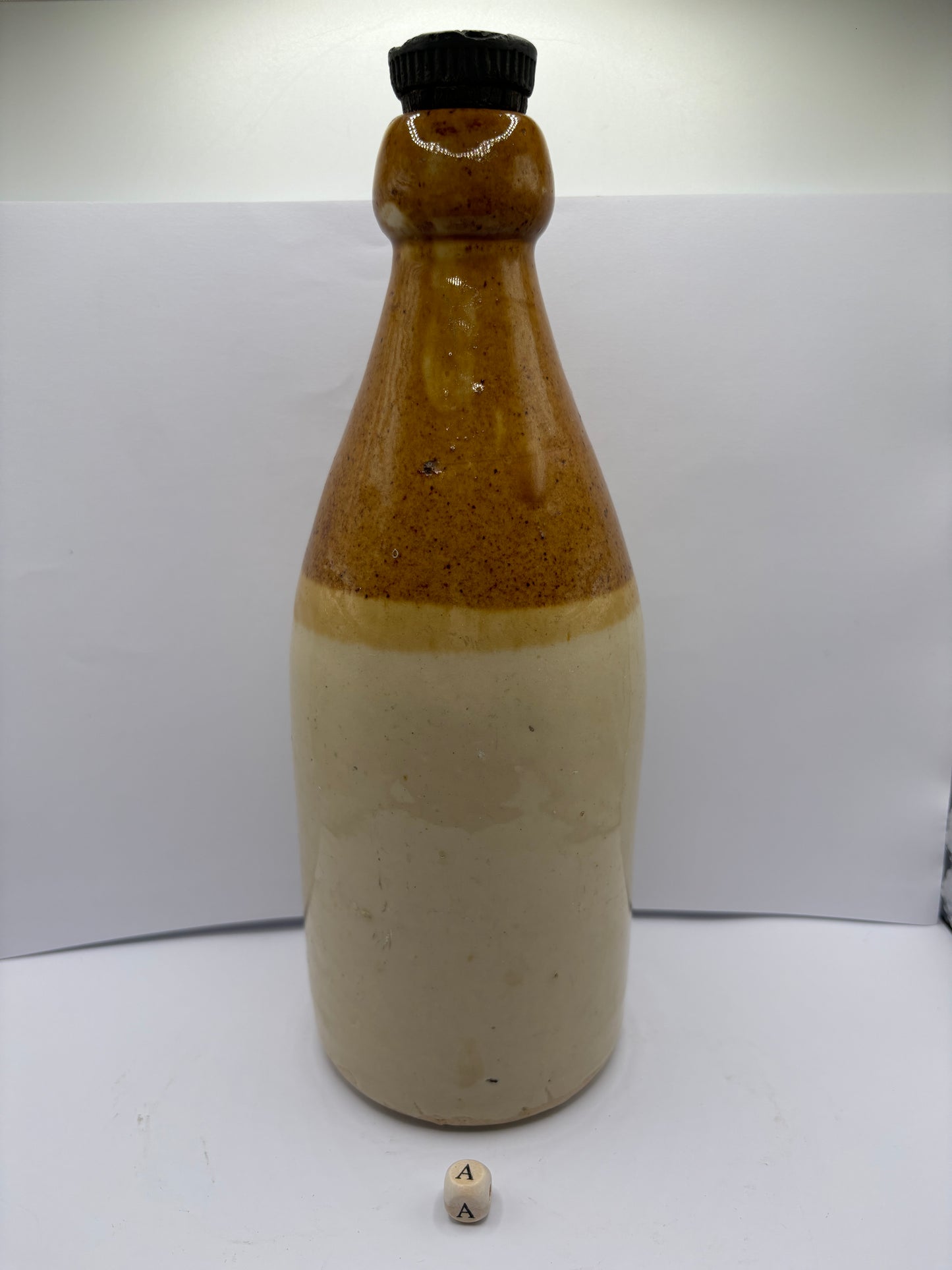 Large plain stoneware ginger beer bottle (a)