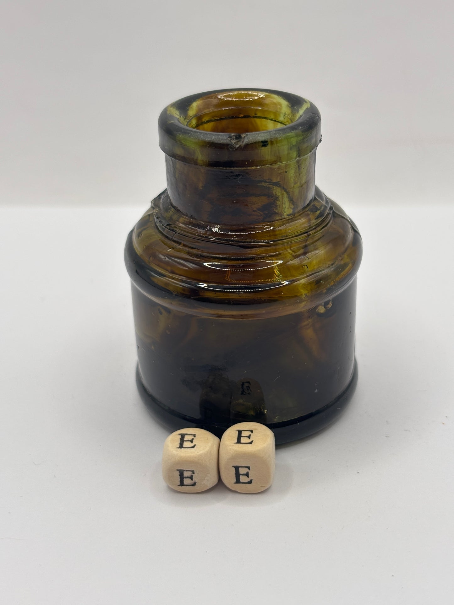 Old dark amber inkwell, ink bottle. Swirly (ee)