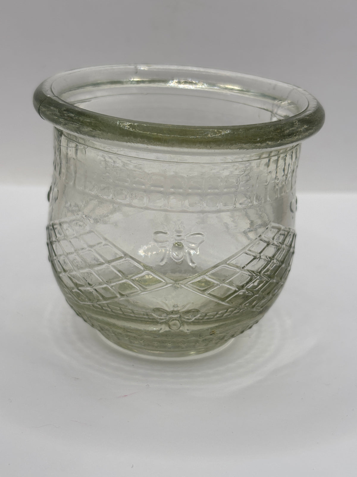 Old clear glass honey pot, honey bees