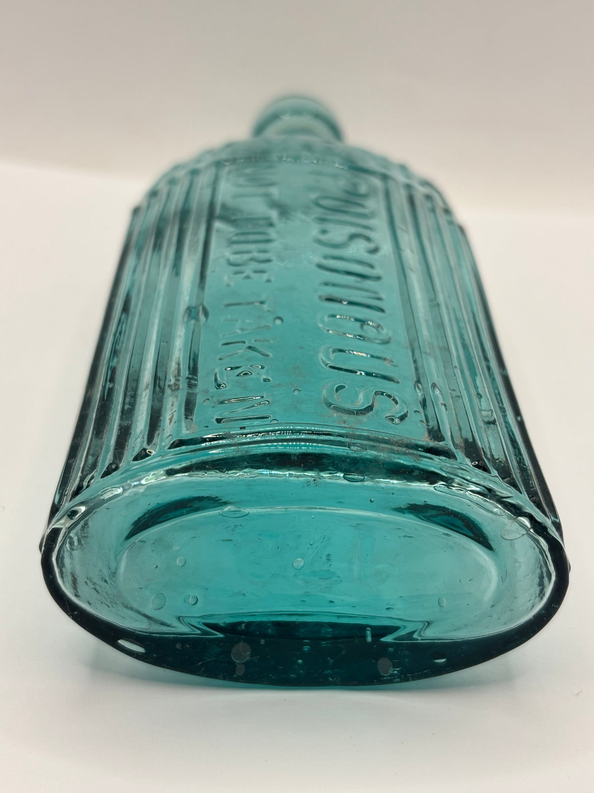 Old aqua glass poison bottle, ammonia, POISONOUS not to be taken