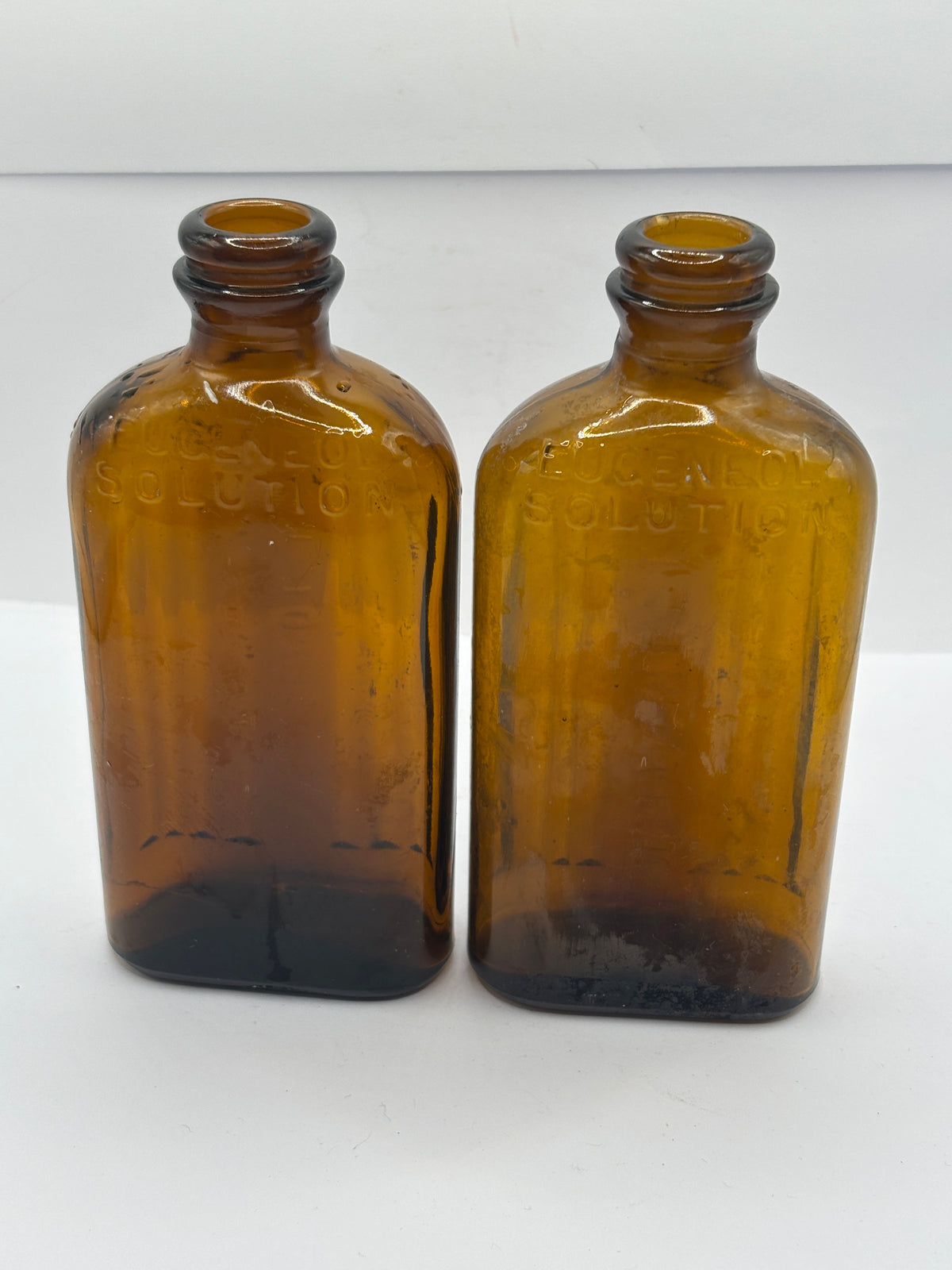 2 old amber glass ribbed poison bottes, not to be taken