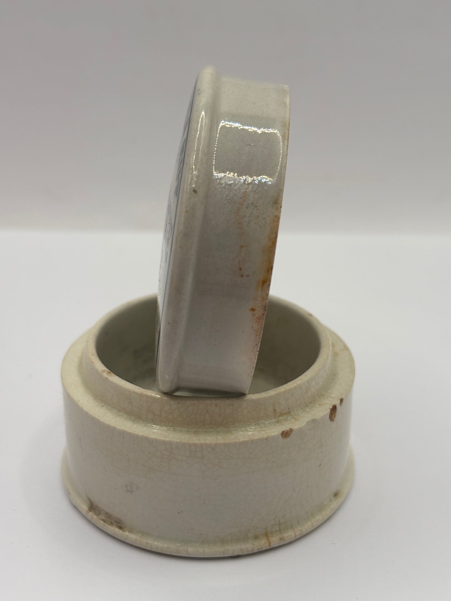 Old advertising lid and base. Woods areca nut tooth paste