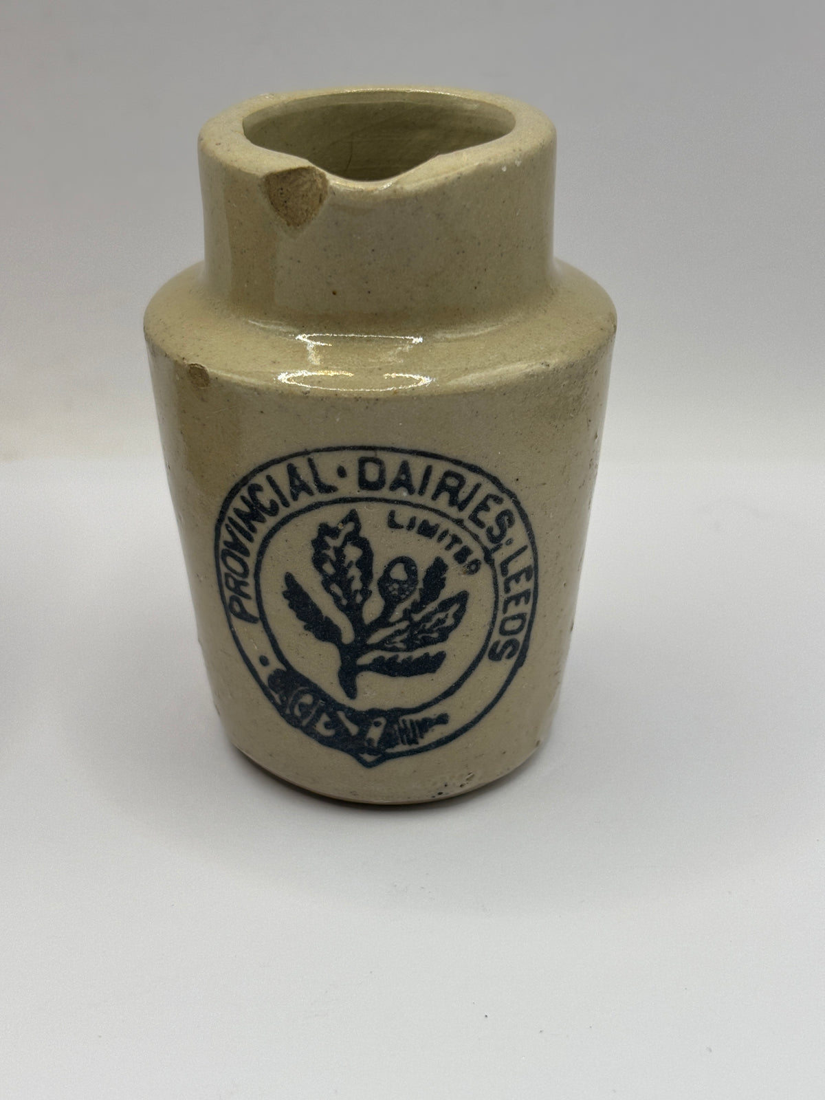 Old advertising cream pot, Provinical dairies Leeds. Chipped
