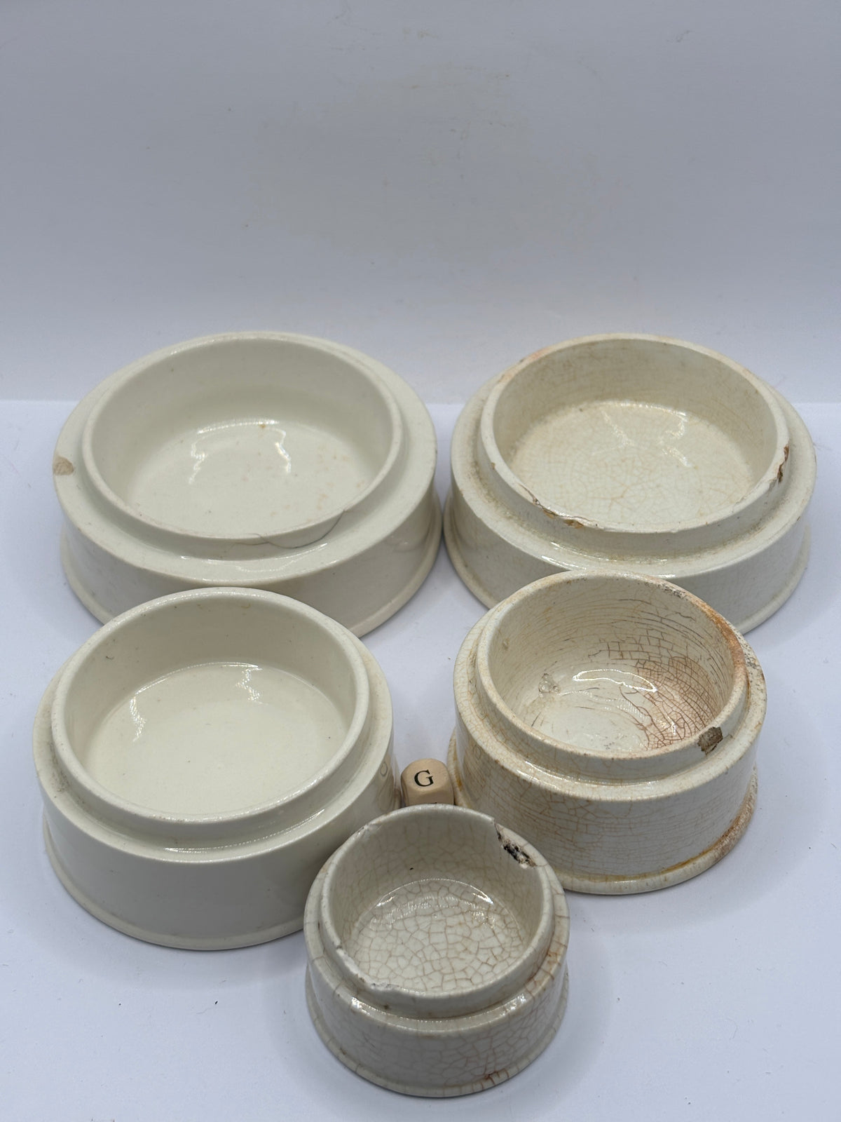5 old stoneware pot lid bases, stackers (G)