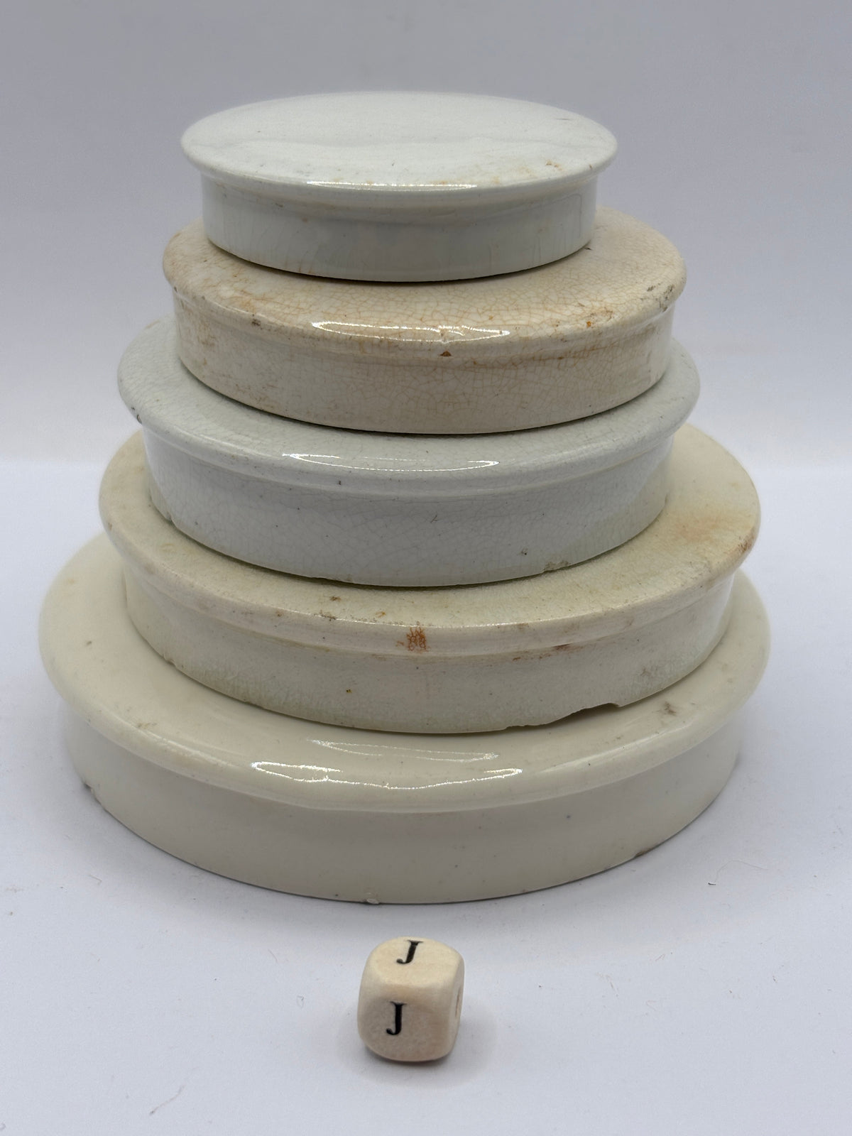 5 old stoneware lids, stackers (J)