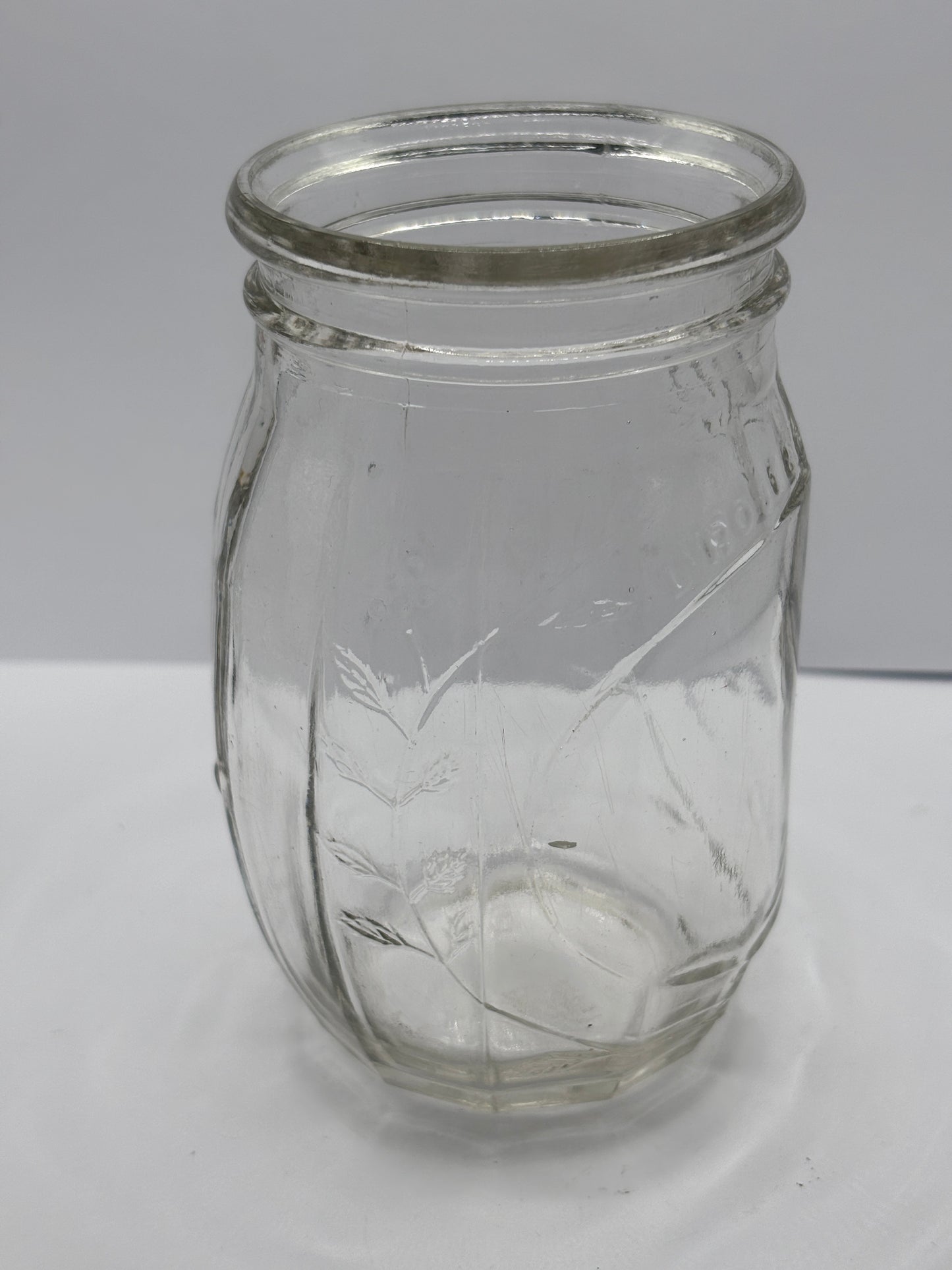 Old clear glass jar, Roses