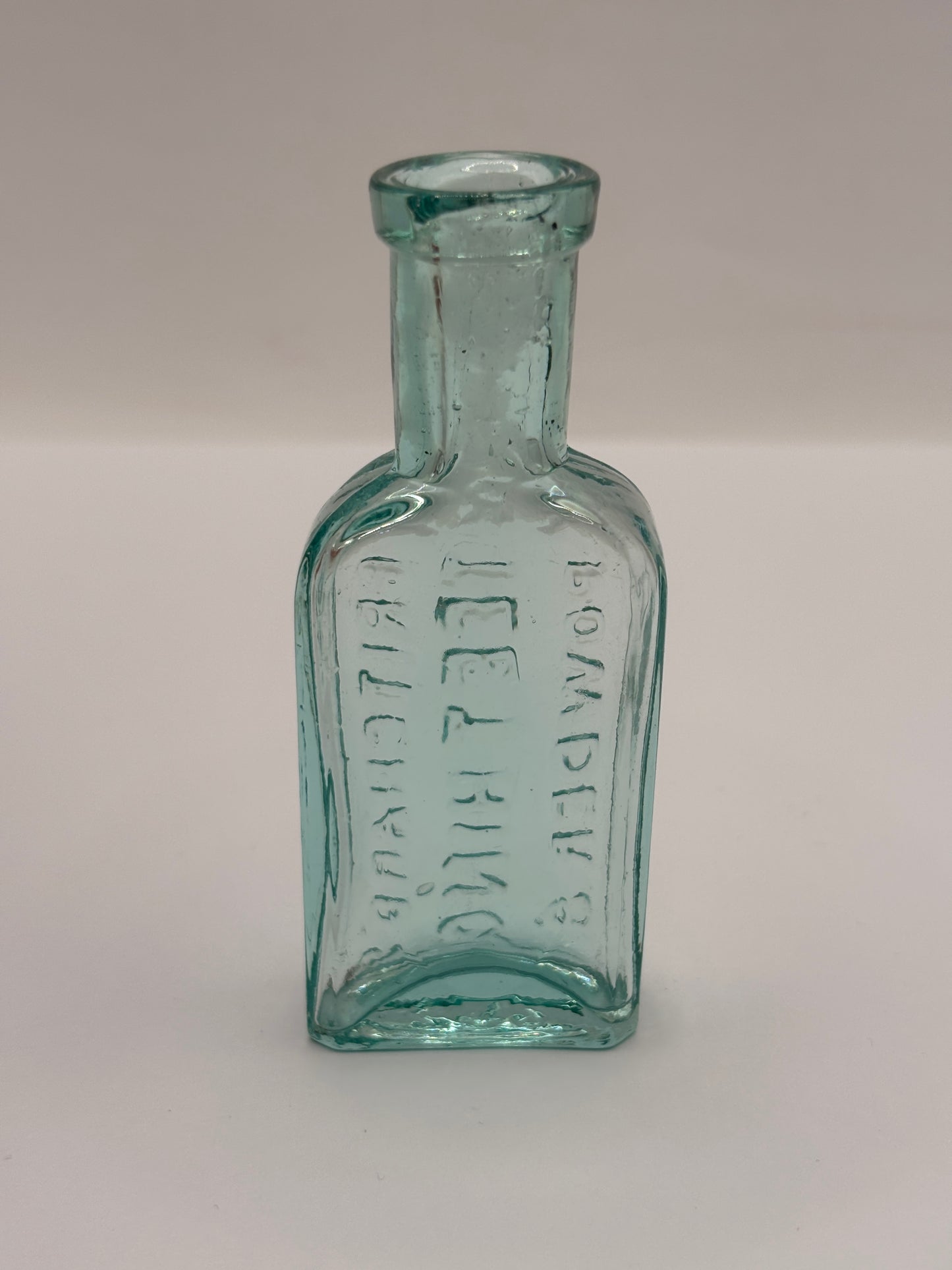 Old aqua glass advertising bottle. Try Pritchards teething powders