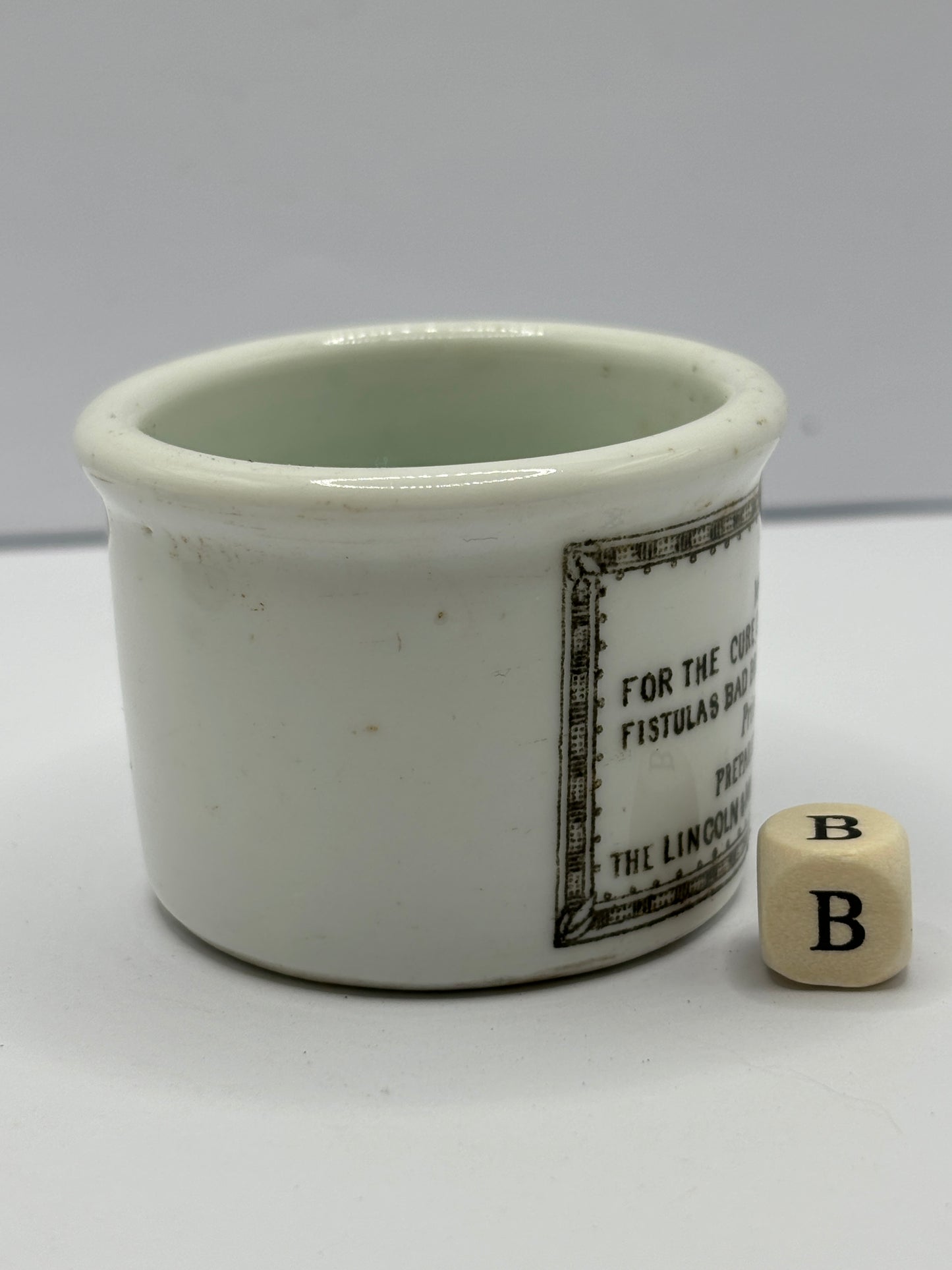 Small Clarke’s miraculous salve advertising ointment pot (b)