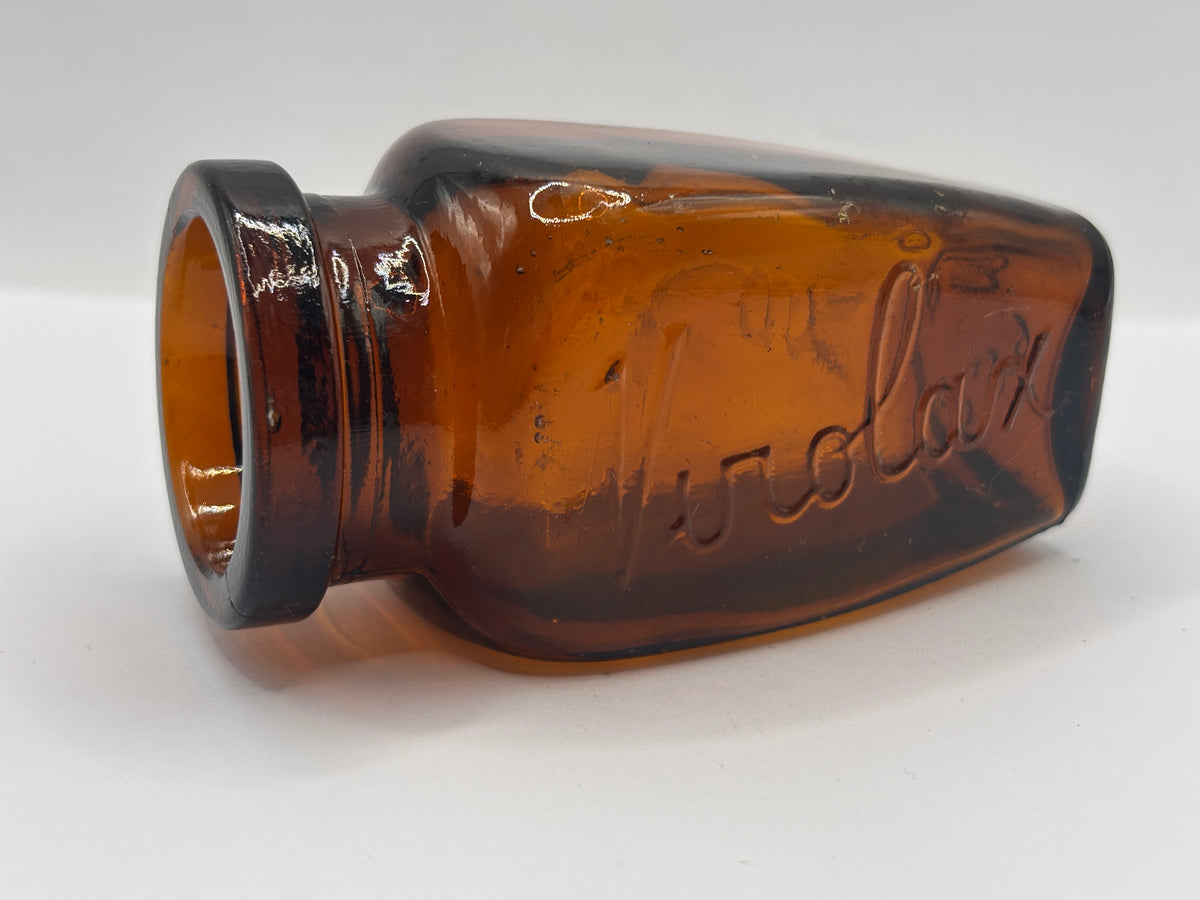 Old amber glass Virolax jar