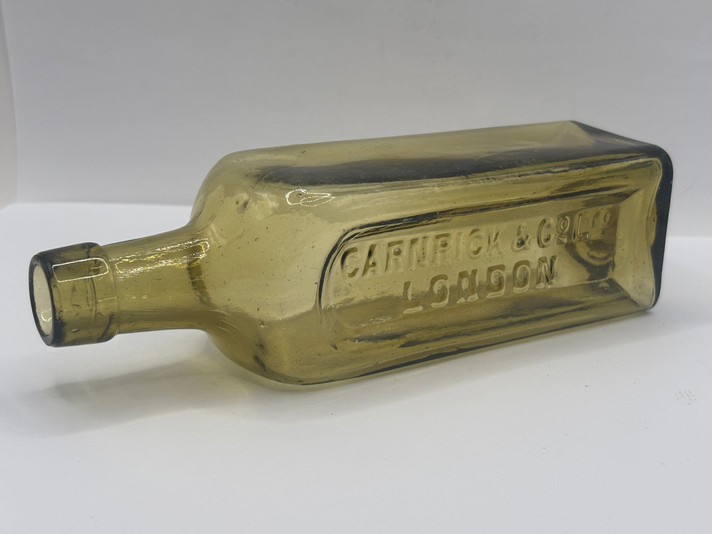 Old glass advertising chemist bottle, London