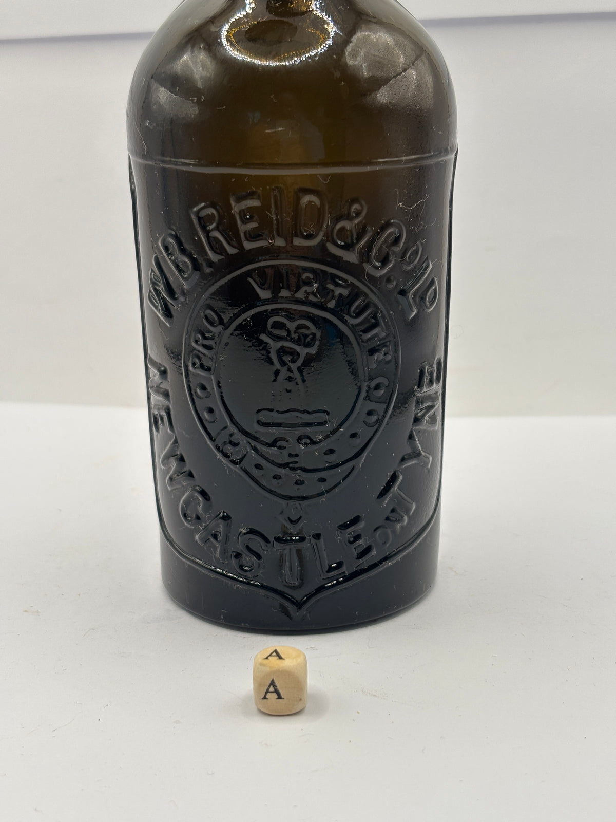 Old advertising beer bottle, WB Reid & Co Newcastle