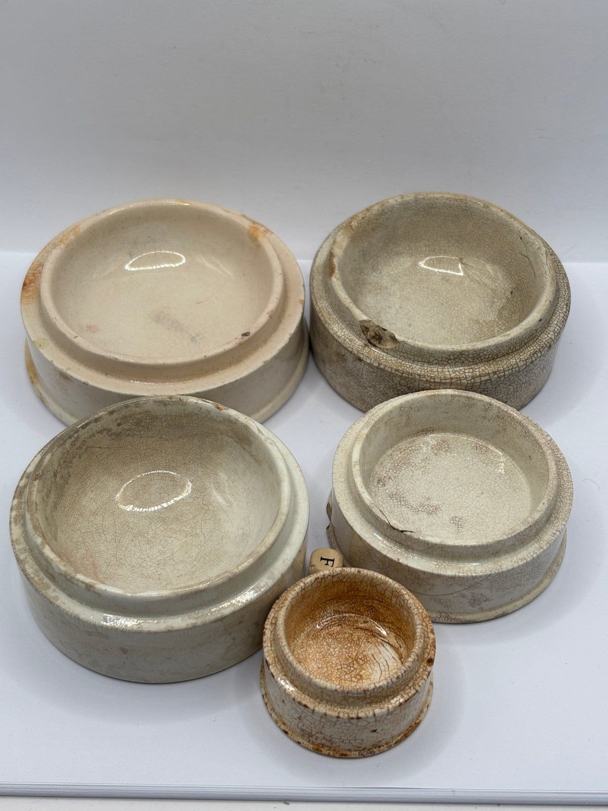 5 old stoneware pot lid bases, stackers (F)