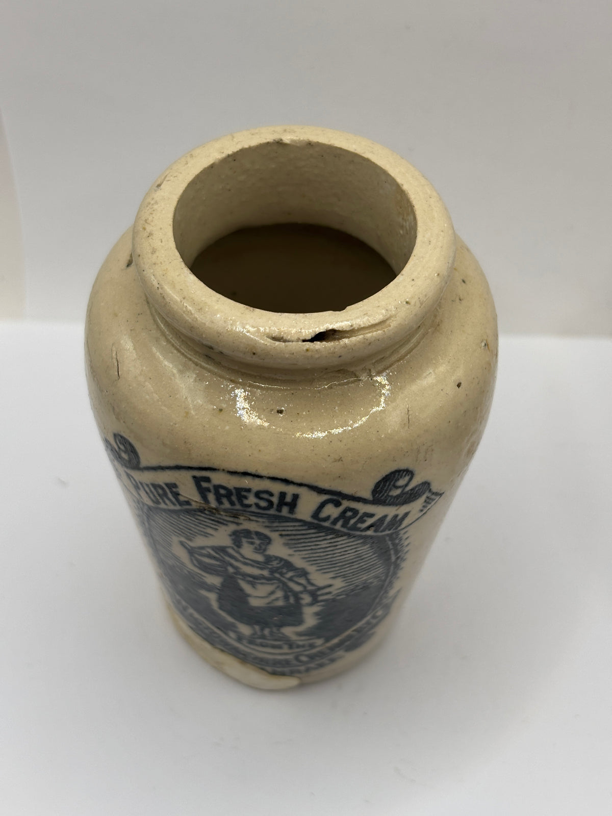 Old advertising cream pot, rich preserved cream stranraer, milkmaid (badly repaired)