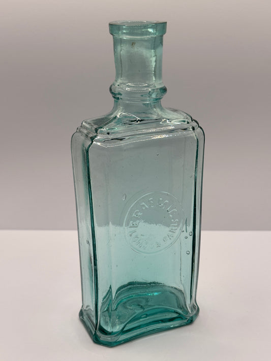 Old aqua glass advertising bottle. Perfume? Erasmic London Paris